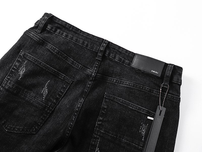 AMIRI Black Distressed Ribbed Knee Jeans — detail