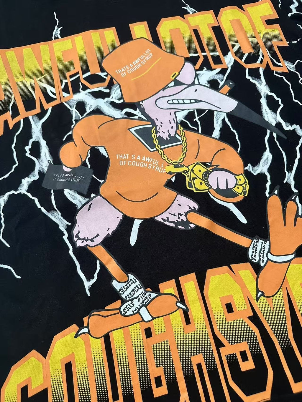 THAT'S A AWFUL LOT OF COUGH SYRUP Lightning Cartoon Graphic T-Shirt — detail